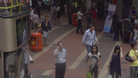 Scenic-video-from-height-of-several-Hong-Kong-natives-waiting-at-the-bus-stop-for-transportation-to-the-bus