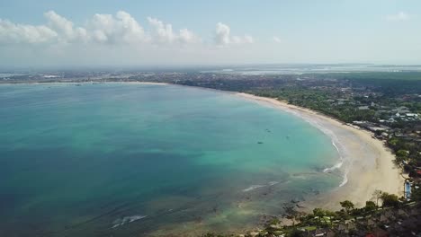 Bali-Indonesia-Beautiful-Jimbaran-Bay-Beach-with-Clear-Blue-Ocean-Aerial-Drone