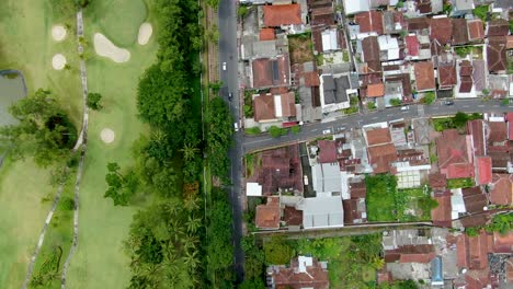 Abstract-pattern-of-residential-district-and-golf-course-in-Magelang,-Indonesia-aerial-top-down