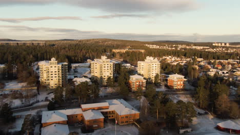 White-Rooftops-And-Snowy-Driveways-In-The-Quiet-City-Of-Sundsvall-In-Sweden--aerial-shot