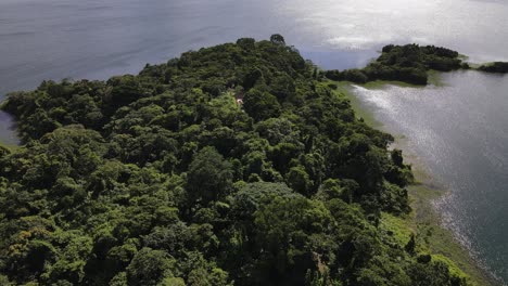 Aerial-video-of-a-viewing-tower-on-the-end-of-a-narrow-peninsula-at-Arenal-lake-near-La-Fortuna
