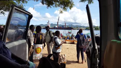 Crowds-of-people-going-about-their-daily-activities-on-Buka-Passage-boat-crossing-on-tropical-island-of-Autonomous-Region-of-Bougainville,-Papua-New-Guinea