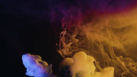 Colorful-smoke-rising-in-black-background--Graphics