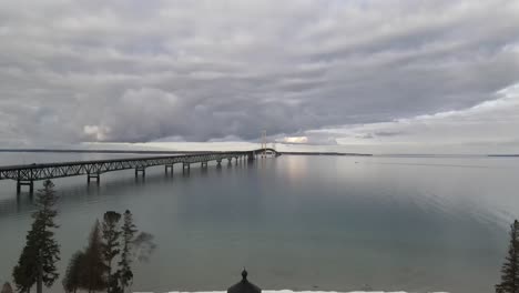 Mackinac-Bridge-drone-video-moving-down-to-Old-Mackinac-Point-Lighthouse-in-winter