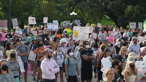 Pro-choice-supporters-rally-during-Women's-March-in-Austin,-protesters-hold-signs-in-support-of-reproductive-rights,-4K