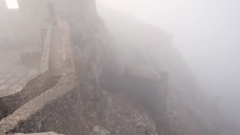Mist-covered-Marvão-Castle-battlement-walls-edge-and-cliff