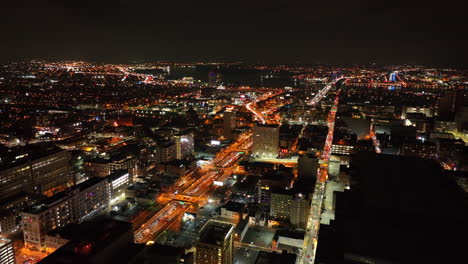 Aerial-establishing-shot-of-city-at-night