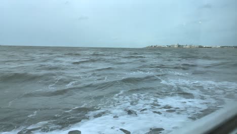 Strong-waves-on-North-Sea-during-stormy-day-during-cruise-with-ferry-ship-to-german-island---Slow-motion-window-view