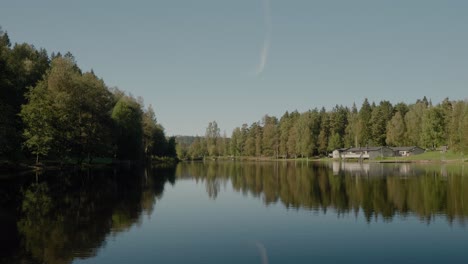 Kypesjön-Lake-With-Pretty-Reflection-in-Late-Summer,-Borås-Sweden---Wide-Shot-Handheld