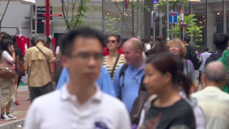 Close-up-of-blurry-face-asiatic-perso-walking-in-the-crowded-busy-street