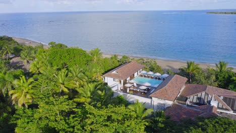 Aerial-view-of-seafront-property-on-tropical-Caribbean-coastline