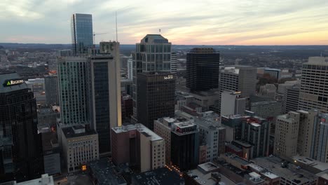 Aerial-view-around-the-financial-district-of-Nashville,-cloudy-dusk-sky-in-Tennessee,-USA---orbit,-drone-shot