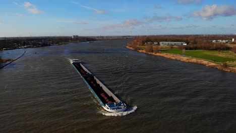 Aerial-View-Of-Sjouwer-Cargo-Ship-Along-Oude-Maas