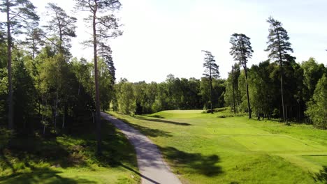 Unrecognizable-professional-golfer-hits-ball-on-golf-course-of-Molndal-near-Gothenburg,-Sweden