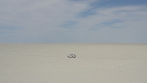 SUV-Car-Driving-On-Dry-Kubu-Island-In-The-Makgadikgadi-Pan-Area-Of-Botswana