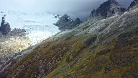 A-tropical-glacier-in-the-Peruvian-Andes-is-melting-due-to-climate-change-and-global-warming---pull-back-aerial-flyover
