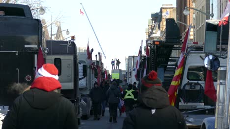 View-Of-Parked-Trucks-And-People-Walking-Along-In-Ottawa-For-Freedom-Convoy-On-January-28-2022