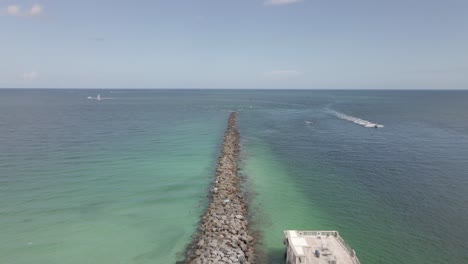 Aerial:-Rip-rap-breakwater-at-South-Pointe-Park-Pier,-Miami-Florida