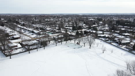 Fly-away-camera-movement-drone-in-a-ice-rink,-Ontario-Canada