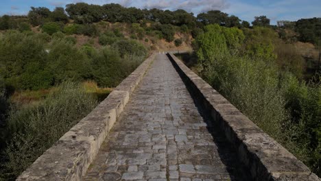 Low-altitude-aerial-fpv-along-Roman-bridge-at-Vila-Formosa-In-Portugal