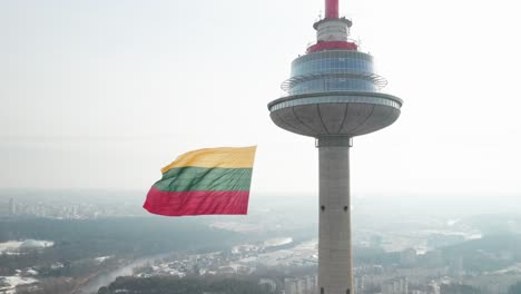 AERIAL:-Slowly-Flying-Around-TV-Tower-on-Sunny-Winter-Noon-on-Day-of-Re-establishment-of-the-State-of-Lithuania