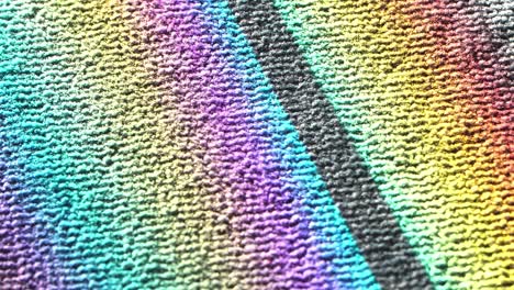 Colorful-light-refraction-on-carpet,-close-up-view