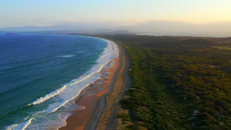 Fast-moving-Aerial-view-of-Scenic-Wild-Natural-Beach---Port-Kembla-near-Wollongong,-NSW-Australia