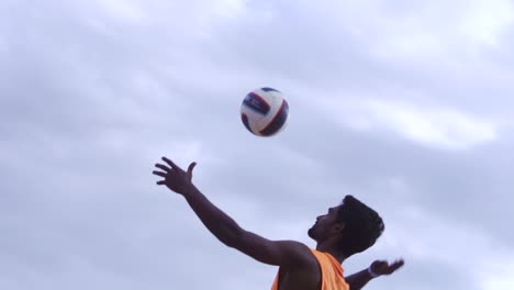 Medium-shot-of-Indian-male-smashing-volleyball-during-volleyball-competition-in-slow-motion