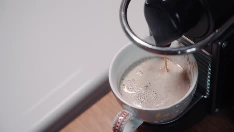 Top-down-view-of-coffee-dripping-into-mug-with-room-for-text-4k-60p