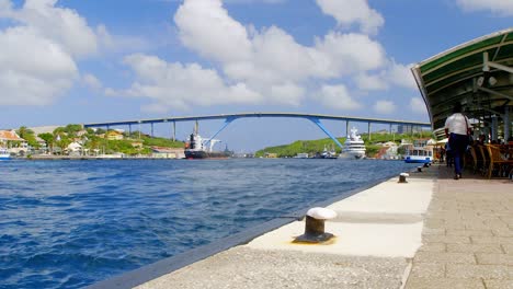 Waterfront-cafe-by-the-Queen-Juliana-Bridge-in-the-beautiful-city-of-Punda,-Willemstad,-on-the-Caribbean-island-of-Curacao