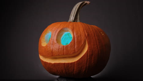 Colorful-Eye-Glowing-Jack-O-Lanterns-Spinning-With-Black-Background-For-Halloween