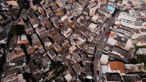Drone-Flying-with-the-camera-tlted-down-over-São-Mateus,-one-of-the-largest-slum-in-São-Paulo,-Brazil