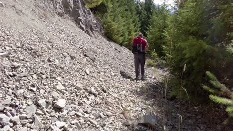 Male-Hiker-Walk-Up-Rocky-Talus-and-Shale-on-the-Side-of-a-Mountain---Thunder-Mountain,-Vancouver-Island,-BC,-Canada