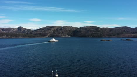 Ferry-Julsund-from-Fjord1-company-is-sailing-from-Hodnanes-to-Jektevik-along-Norwegian-coast---Sunny-day-aerial