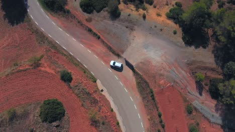 Car-tracking-from-drone-at-60mts-in-high-view-following-the-mountain-road