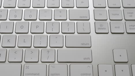 slow-motion-top-down-view-of-an-apple-magic-keyboard-close-up