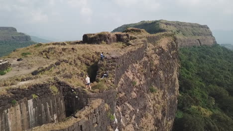 Adventurous-tourists-explore-ancient-Vinchu-Kada-fort-hill-station