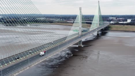 Mersey-gateway-landmark-aerial-view-above-toll-suspension-bridge-river-crossing-high-angle-reversing-shot