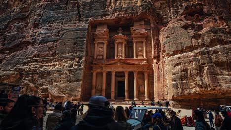 Time-lapse-of-people-at-the-Treasury,-the-famous-historic-UNESCO-heritage-site-carved-into-sandstone-at-Petra,-Jordan