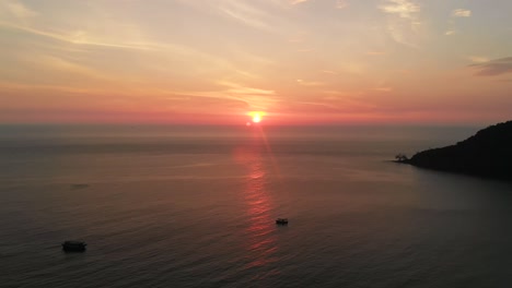 Orange-sunset-in-Cambodia,-Koh-Rong-island,-high-aerial-drone-view