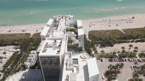 Aerial-flight-over-luxury-penthouse-condos-on-sunny-Miami-Beach