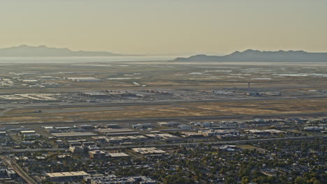 Salt-Lake-City-Utah-Aerial-v28-establishing-high-angle-panning-shot-across-airport-airfield-with-beautiful-landscape-views-in-the-background---Shot-with-Inspire-2,-X7-camera---October-2021