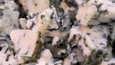 Macro-shot-of-roquefort-cheese-chopped-in-small-pieces