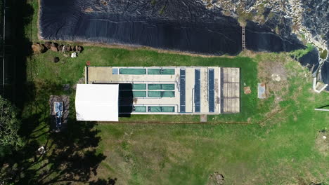 aerial-shot-of-treatment-plant,-drone,-retention-lagoon