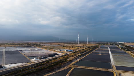 Salt-fields-and-wind-turbines.-Aerial-circular-view