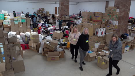Volunteers-sort-through-boxes-of-donated-clothing-in-the-Art-Palace-of-Lviv-that-has-been-converted-into-the-largest-aid-centre-in-the-region-during-the-Russian-war-against-Ukraine