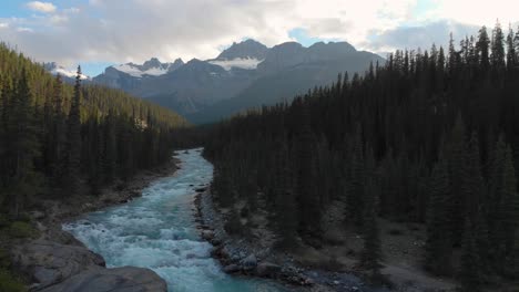 Mistaya-canyon-in-Banff-national-park-in-Canada,-Alberta,-aerial-drone-low-flight-view,-Mount-Sarbach-in-background