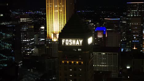 Cinematic-aerial,-Foshay-Tower-in-downtown-Minneapolis-skyline-at-night
