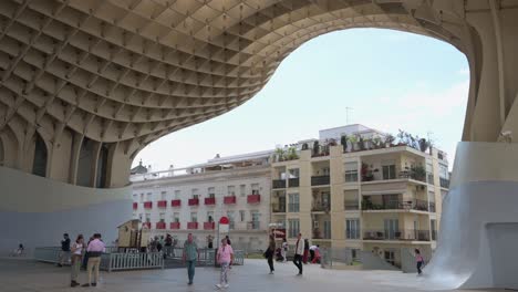 People-are-seen-at-the-Setas-de-la-Encarnacion-square,-designed-by-Berlin-architect-Jurgen-Mayer,-in-Seville-,-Spain