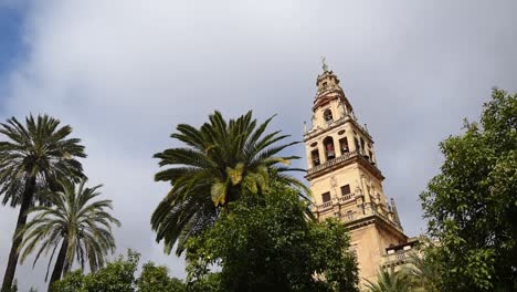 Bell-Tower-of-Cordoba-Mosque-Cathedral-and-palm-trees-Andalusia,-Spain